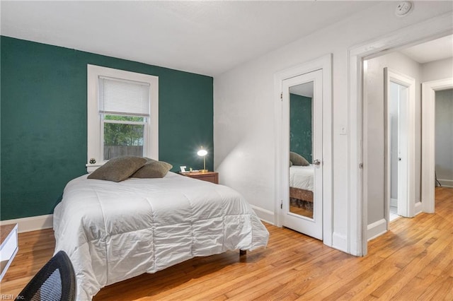 bedroom with light hardwood / wood-style floors