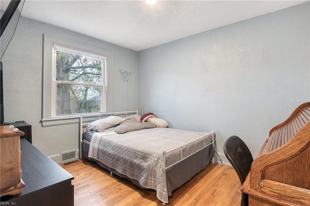 bedroom featuring light hardwood / wood-style flooring