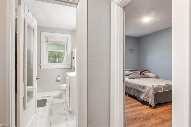 bedroom with light hardwood / wood-style flooring