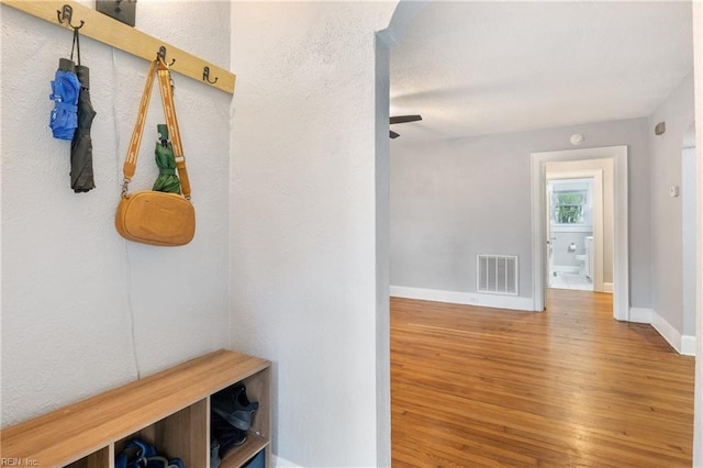 mudroom with hardwood / wood-style floors