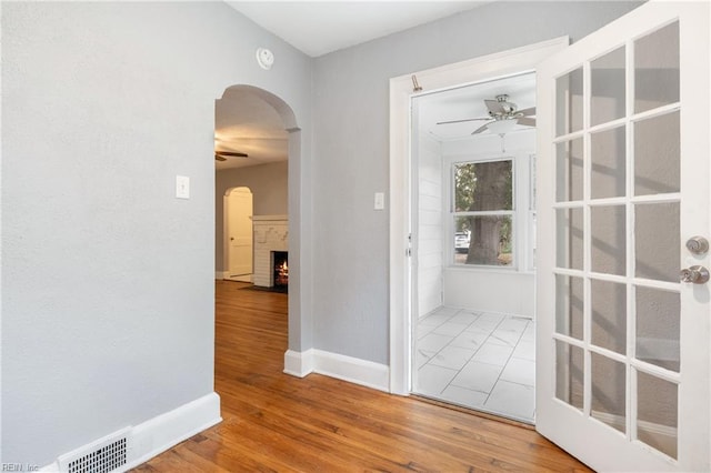 hall with hardwood / wood-style flooring