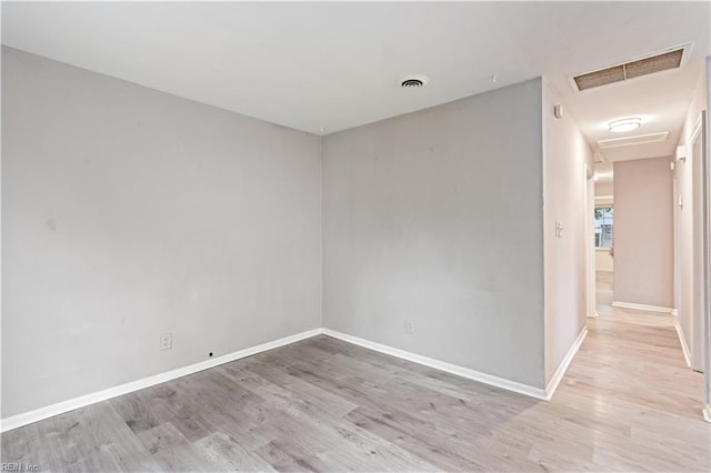 unfurnished room featuring light hardwood / wood-style flooring