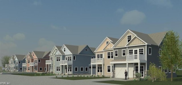 rear view of house with a balcony and a garage