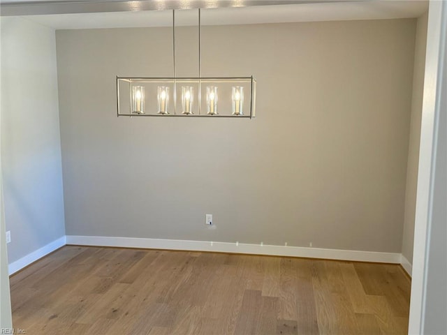 spare room featuring light hardwood / wood-style floors