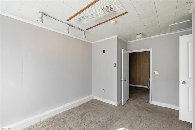 unfurnished room featuring carpet flooring and ornamental molding