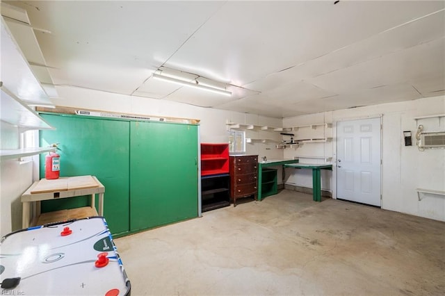 basement featuring a wall unit AC