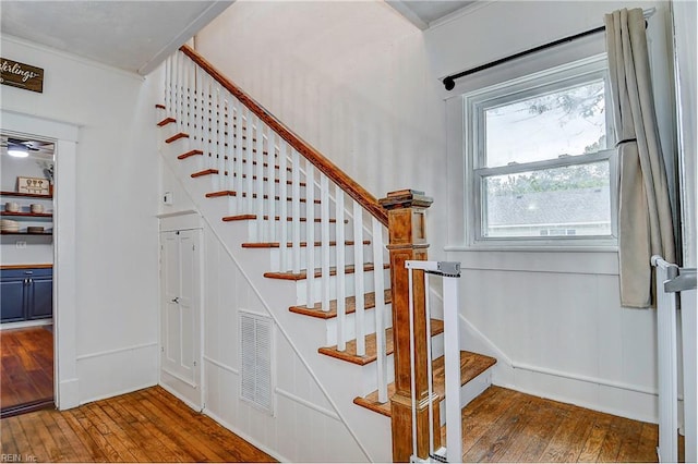 stairway featuring hardwood / wood-style flooring