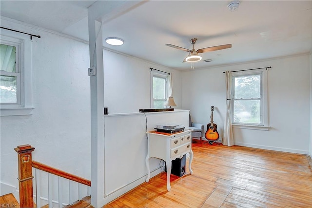 miscellaneous room featuring ceiling fan and light wood-type flooring