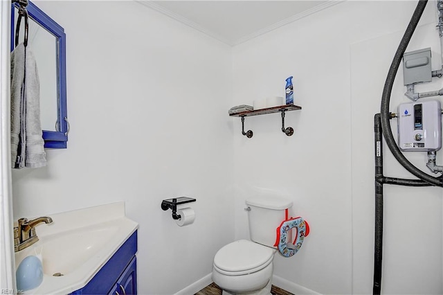 bathroom featuring toilet, vanity, and ornamental molding