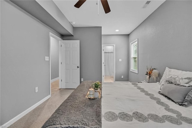 bedroom featuring ceiling fan and light carpet