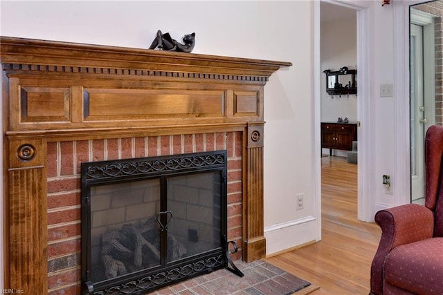 interior details with a fireplace and hardwood / wood-style floors