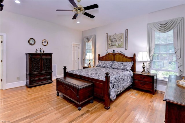 bedroom with light wood-type flooring and ceiling fan