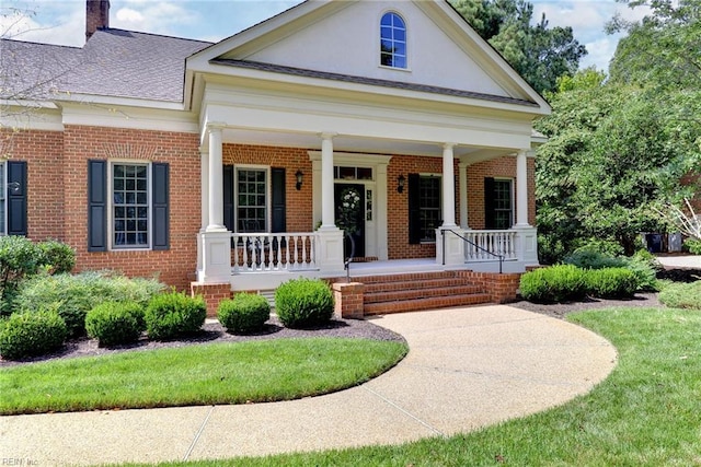 greek revival inspired property with a porch