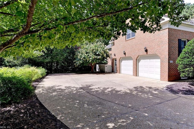 view of property exterior featuring a garage