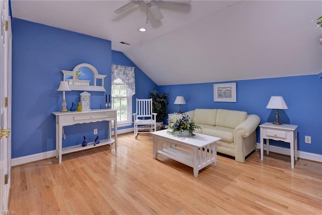 living room featuring light hardwood / wood-style floors, ceiling fan, and lofted ceiling