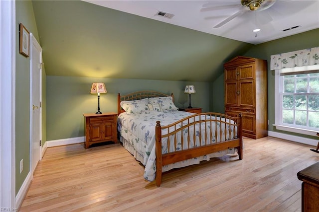 bedroom featuring ceiling fan, vaulted ceiling, and light hardwood / wood-style flooring