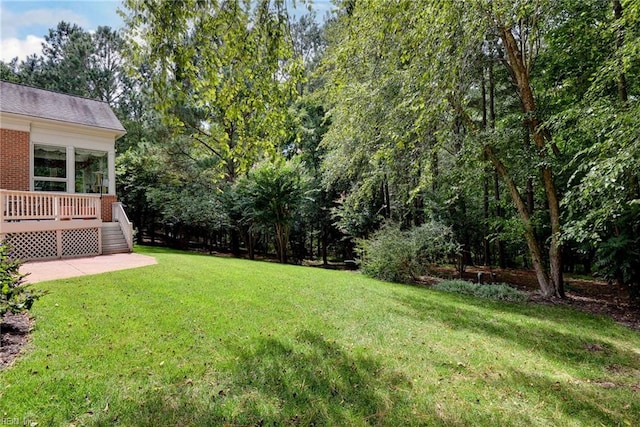 view of yard with a deck