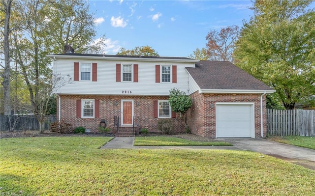 view of front of property featuring a front yard and a garage