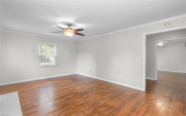 unfurnished room featuring ceiling fan, dark hardwood / wood-style floors, and crown molding