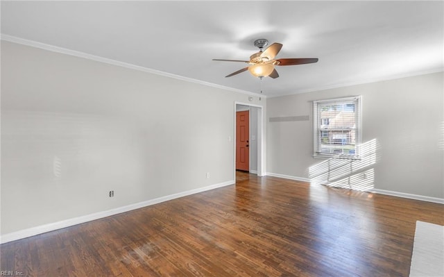 empty room with ceiling fan, ornamental molding, and dark wood-type flooring