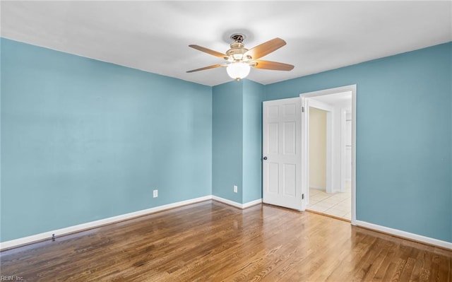 unfurnished room with ceiling fan and light hardwood / wood-style floors