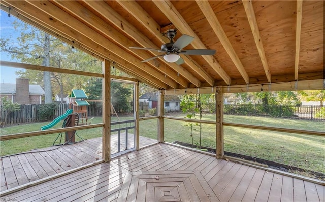 unfurnished sunroom featuring ceiling fan and lofted ceiling