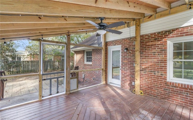 wooden deck featuring ceiling fan