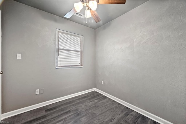 unfurnished room with dark hardwood / wood-style floors and ceiling fan