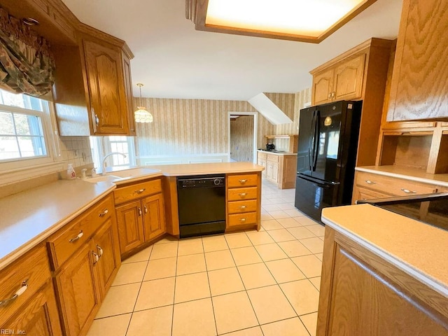 kitchen with decorative backsplash, hanging light fixtures, light tile patterned floors, and black appliances