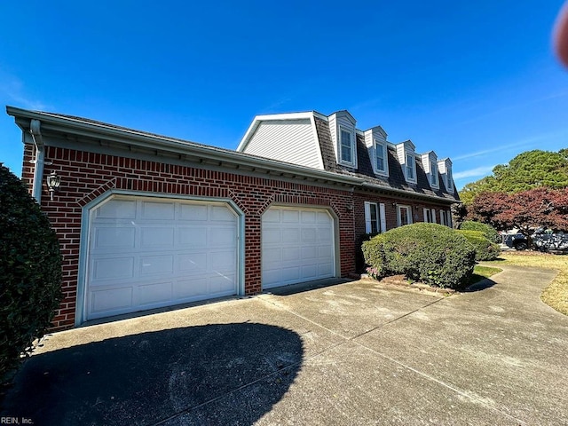 view of side of property with a garage