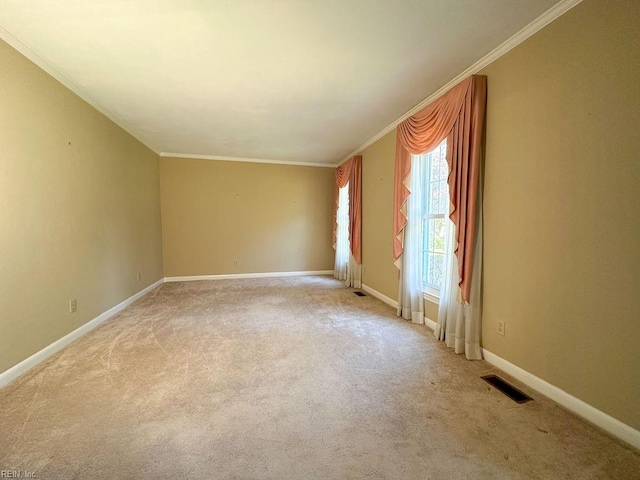 unfurnished room featuring crown molding and light colored carpet