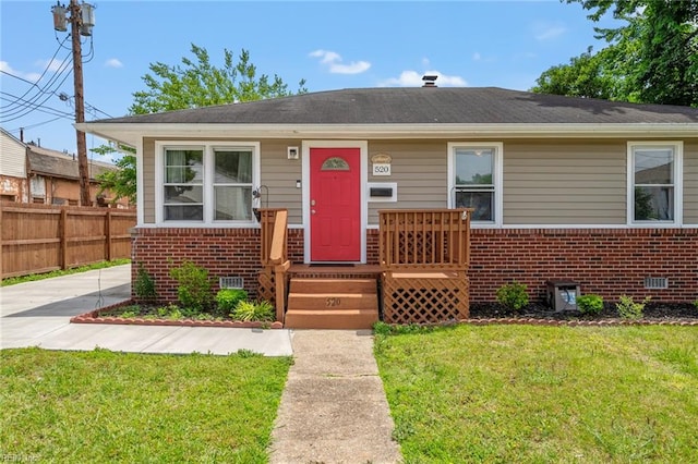 bungalow with a front yard