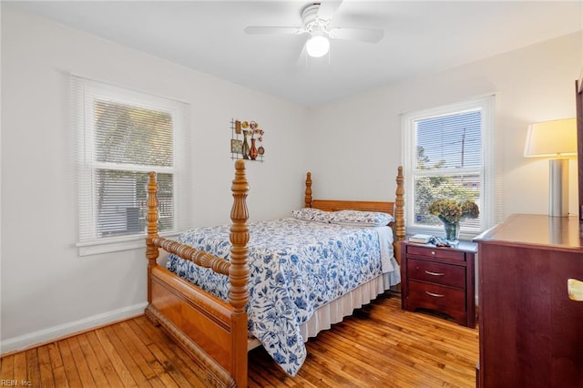 bedroom with ceiling fan and light hardwood / wood-style floors