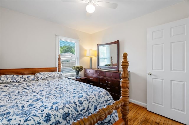 bedroom with ceiling fan and light hardwood / wood-style flooring