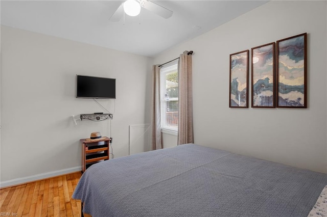 bedroom featuring hardwood / wood-style floors and ceiling fan