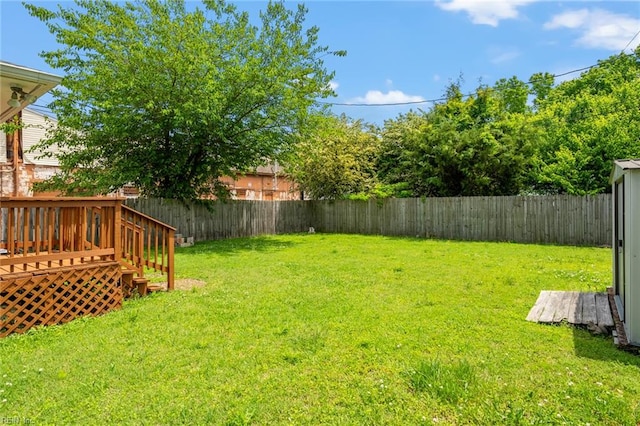 view of yard with a wooden deck