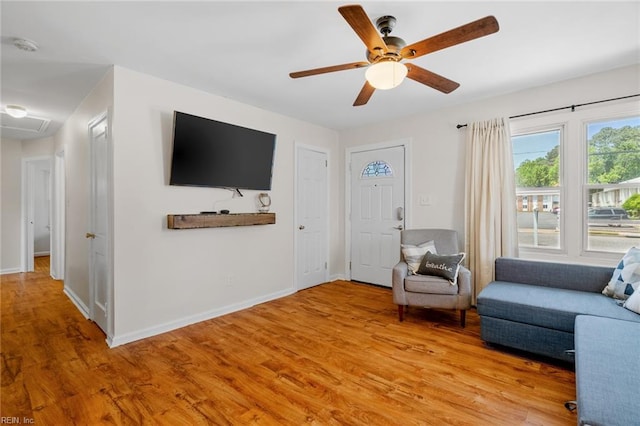 unfurnished living room featuring ceiling fan and light hardwood / wood-style flooring