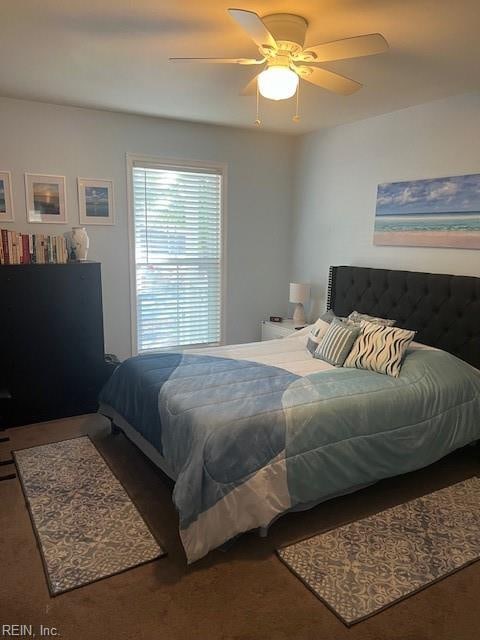 carpeted bedroom featuring ceiling fan