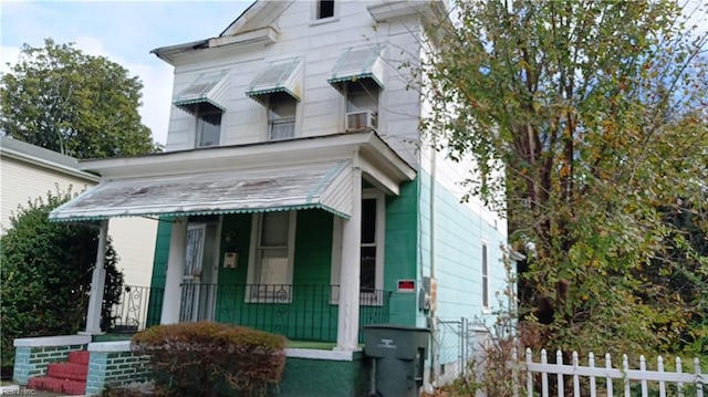 view of front of house with cooling unit and covered porch