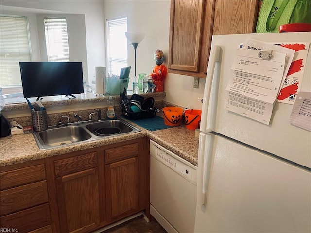 kitchen with white appliances and sink