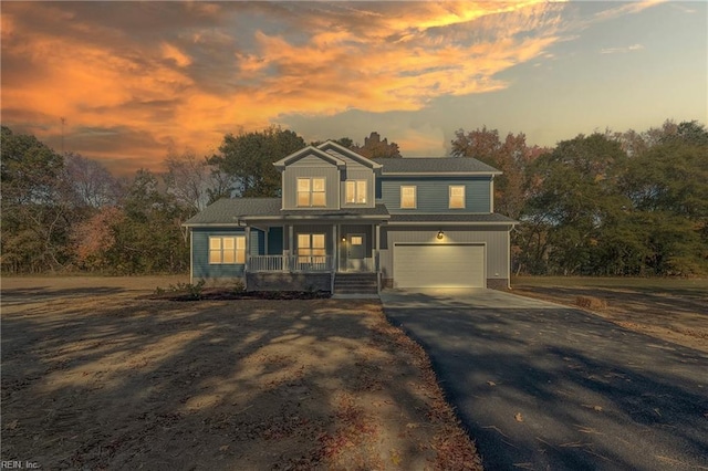 view of front of home with a garage and covered porch