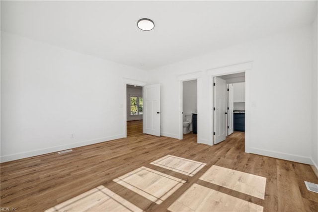 unfurnished bedroom with light wood-type flooring