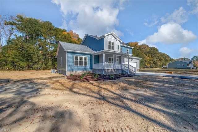 view of front of home featuring central AC unit and a porch