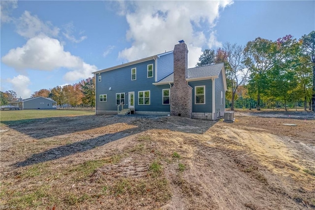 back of house featuring central AC