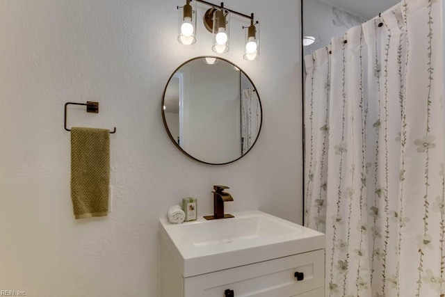 bathroom featuring vanity and walk in shower