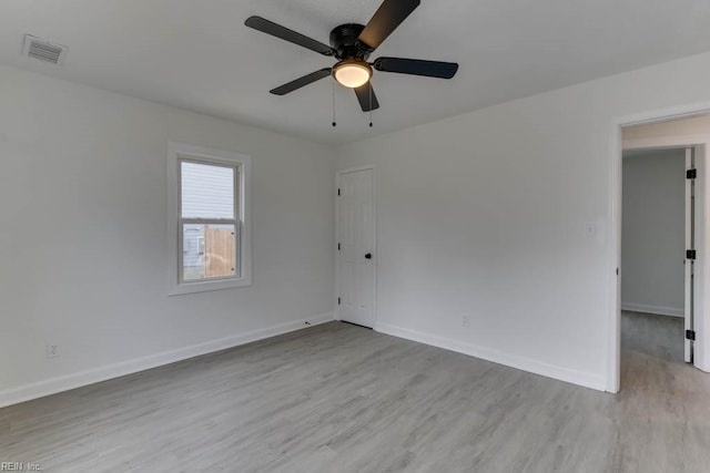 spare room featuring ceiling fan and light wood-type flooring