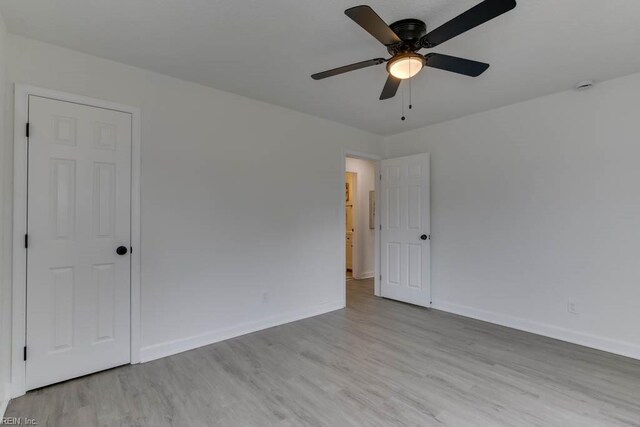 unfurnished room with ceiling fan and light hardwood / wood-style floors