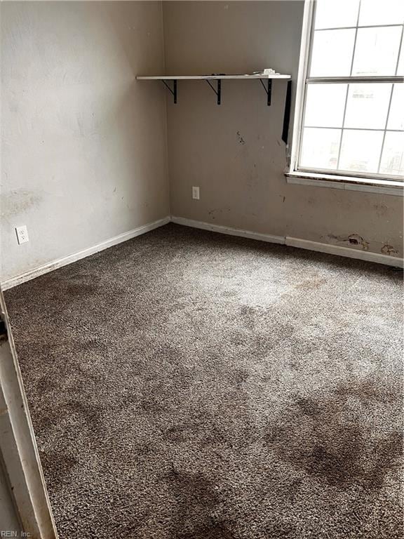 empty room with carpet flooring