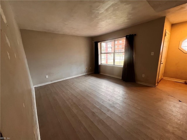 empty room featuring hardwood / wood-style floors