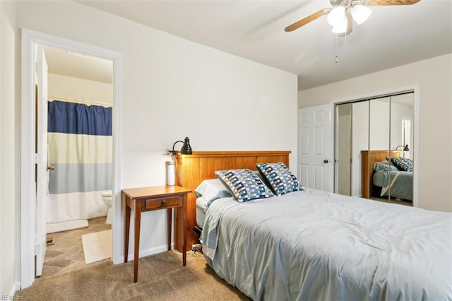 carpeted bedroom featuring ceiling fan and a closet